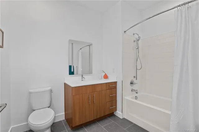 a bathroom with a toilet a sink and bathtub