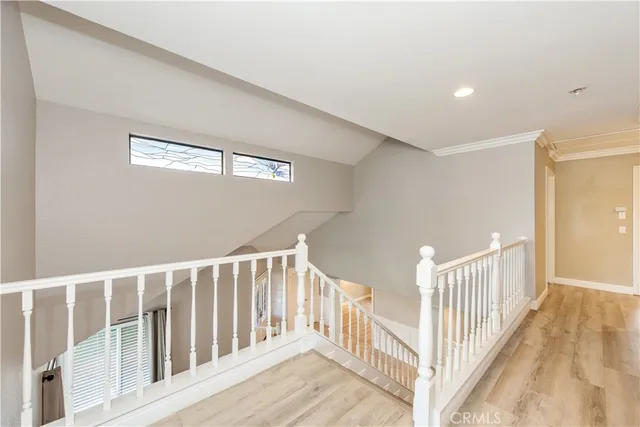 a view of staircase with rug