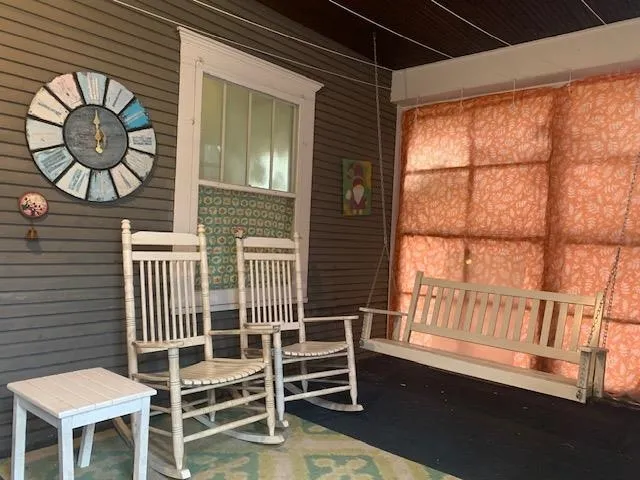 a front view of a house with a large window