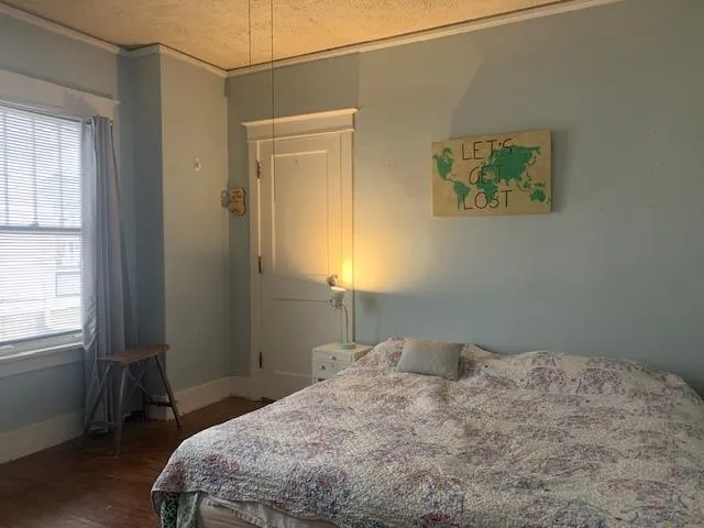 a bedroom with a bed and a cabinets