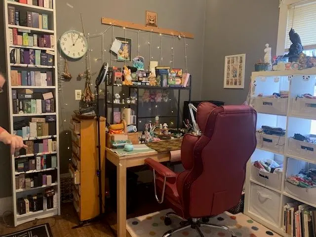 a bathroom with a shower and a chair