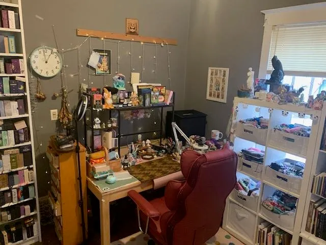 a view of a dining room with furniture and window