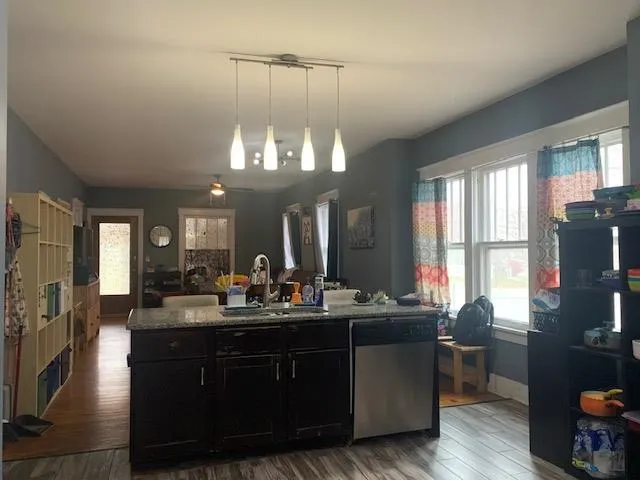 a room with a chandelier furniture and a large window