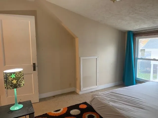 a room with furniture and a window