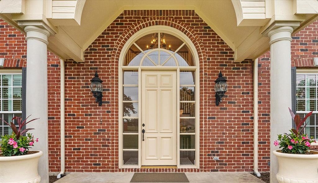 506 Meadowview Road Heath, TX 75032 - Photo 6 of 32 a view of a brick house with plants