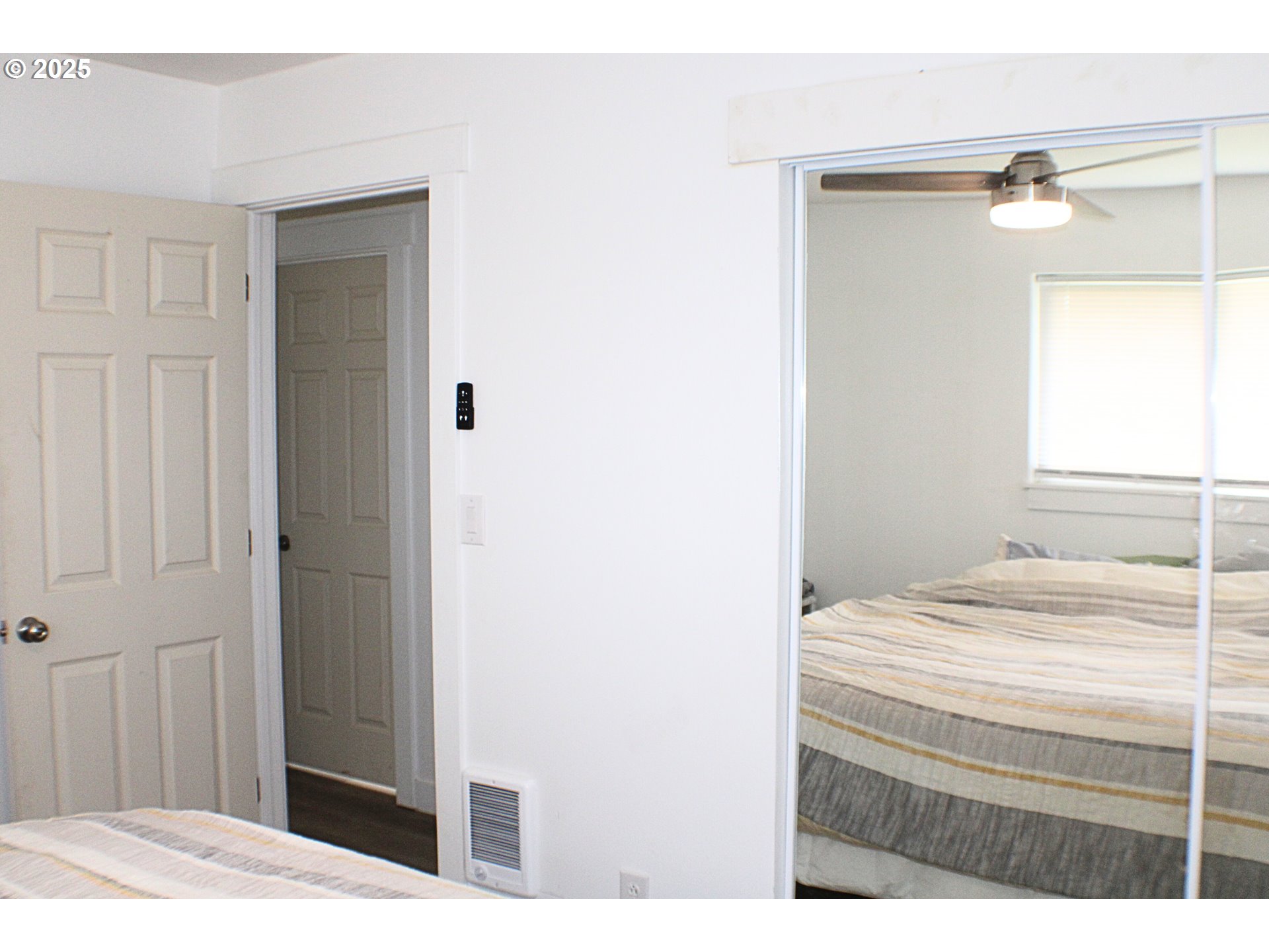 616 4th Avenue Riddle, OR 97469 - Photo 15 of 36 a bedroom with a bed and a mirror