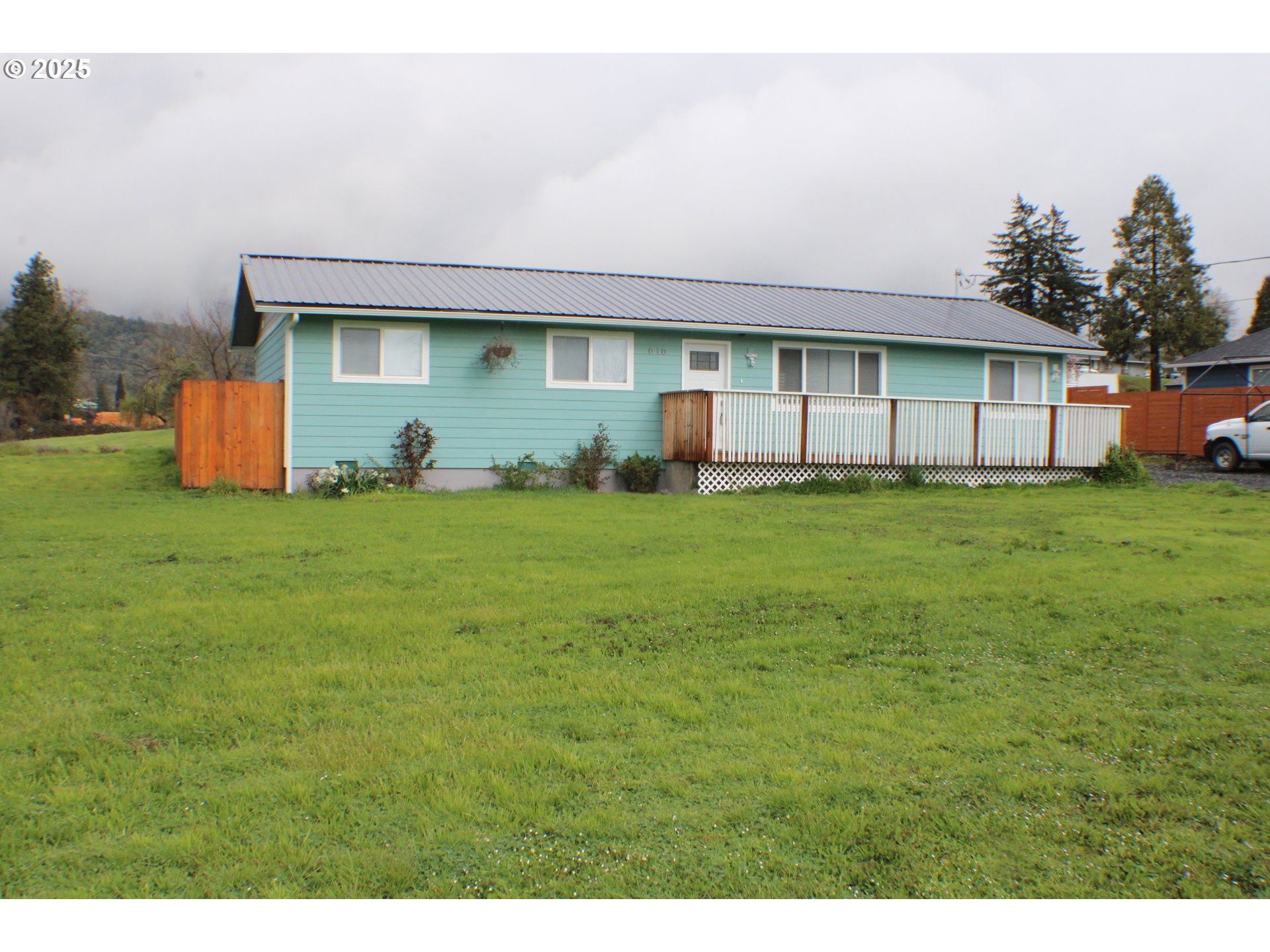 616 4th Avenue Riddle, OR 97469 - Photo 18 of 36 a view of a house with a yard