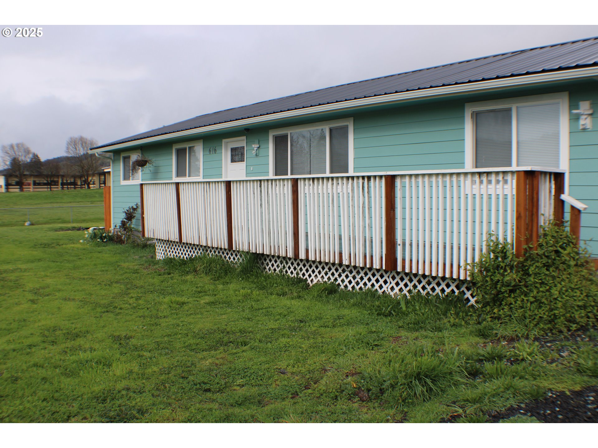 616 4th Avenue Riddle, OR 97469 - Photo 20 of 36 a front view of a house with a garden