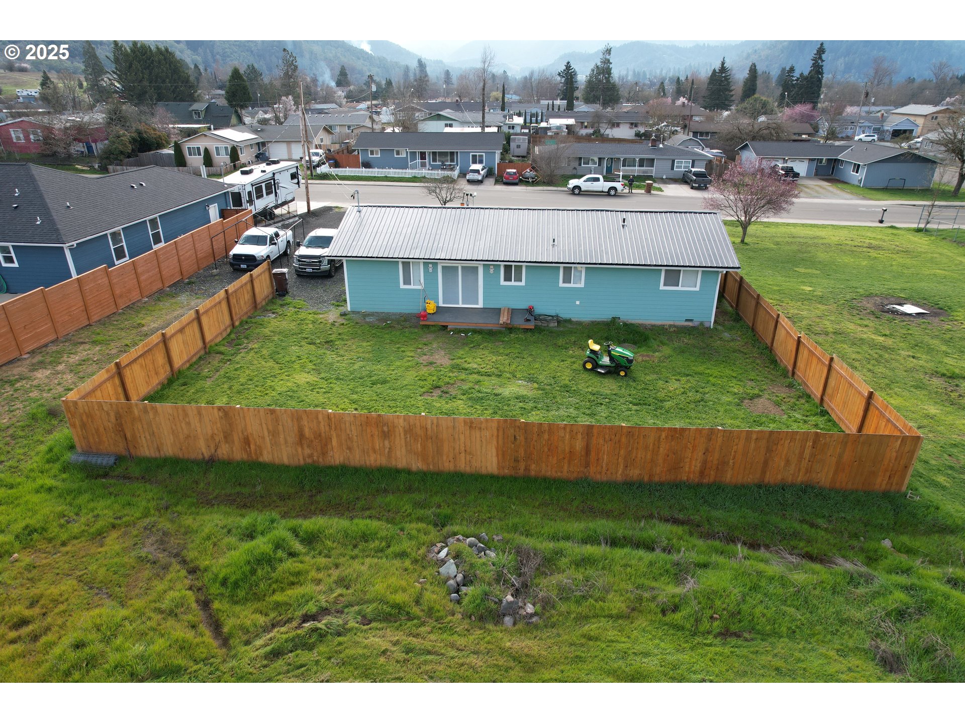 616 4th Avenue Riddle, OR 97469 - Photo 25 of 36 a view of a house with a yard and sitting area
