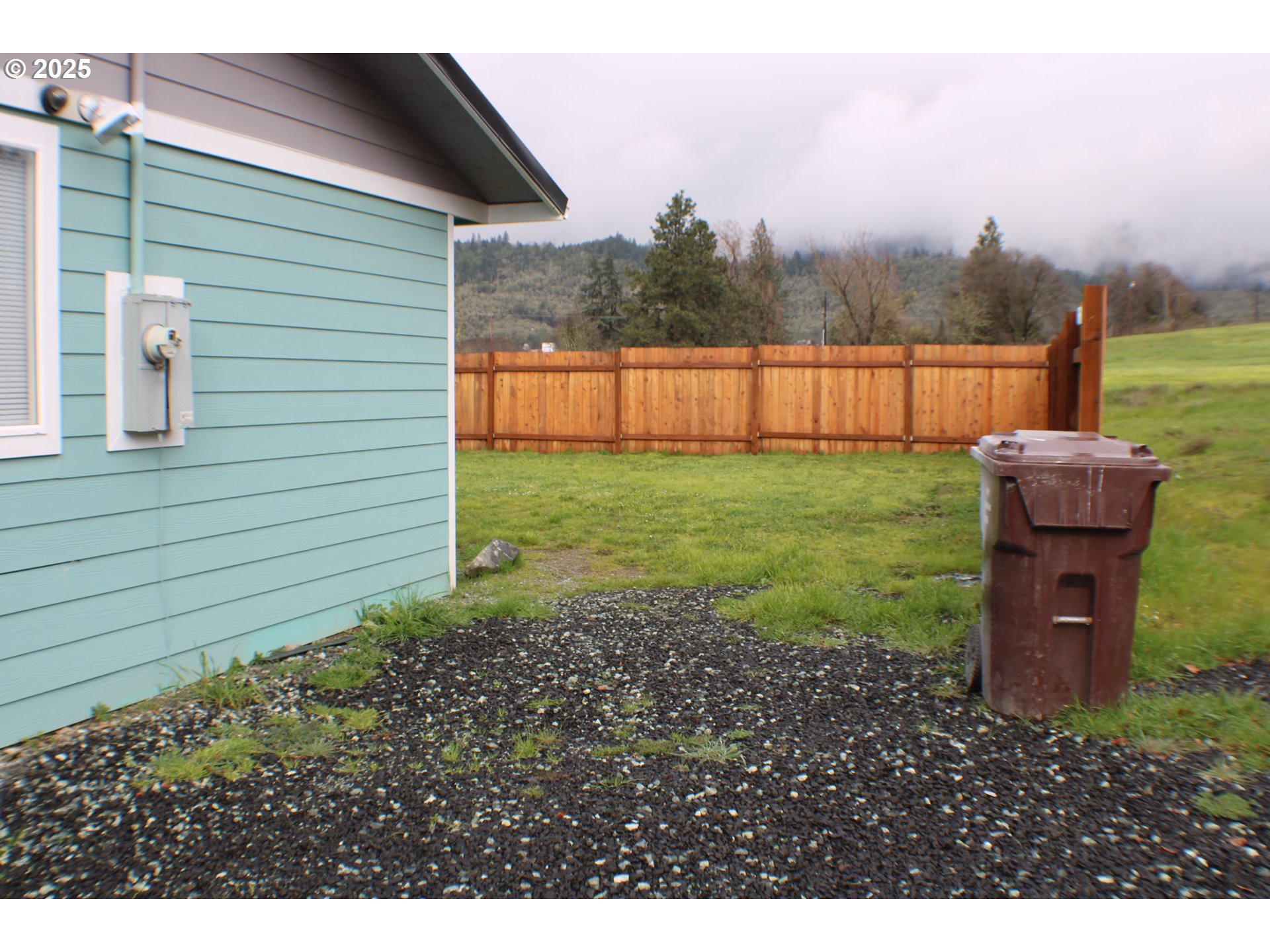 616 4th Avenue Riddle, OR 97469 - Photo 27 of 36 a backyard of a house with lots of green space
