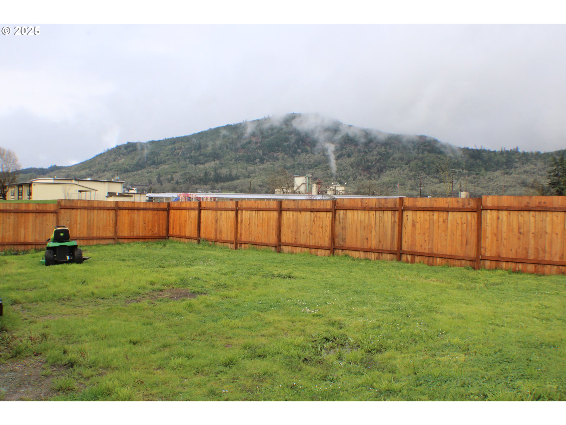 616 4th Avenue Riddle, OR 97469 - Photo 28 of 36 a view of a yard with a house in the background