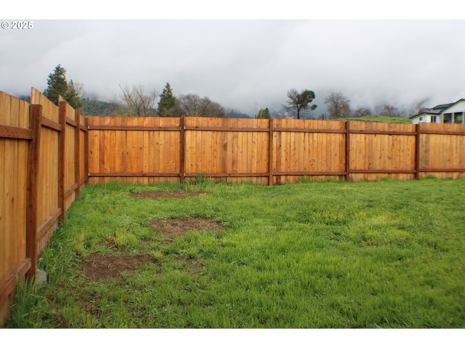 616 4th Avenue Riddle, OR 97469 - Photo 31 of 36 a view of a yard with wooden fence