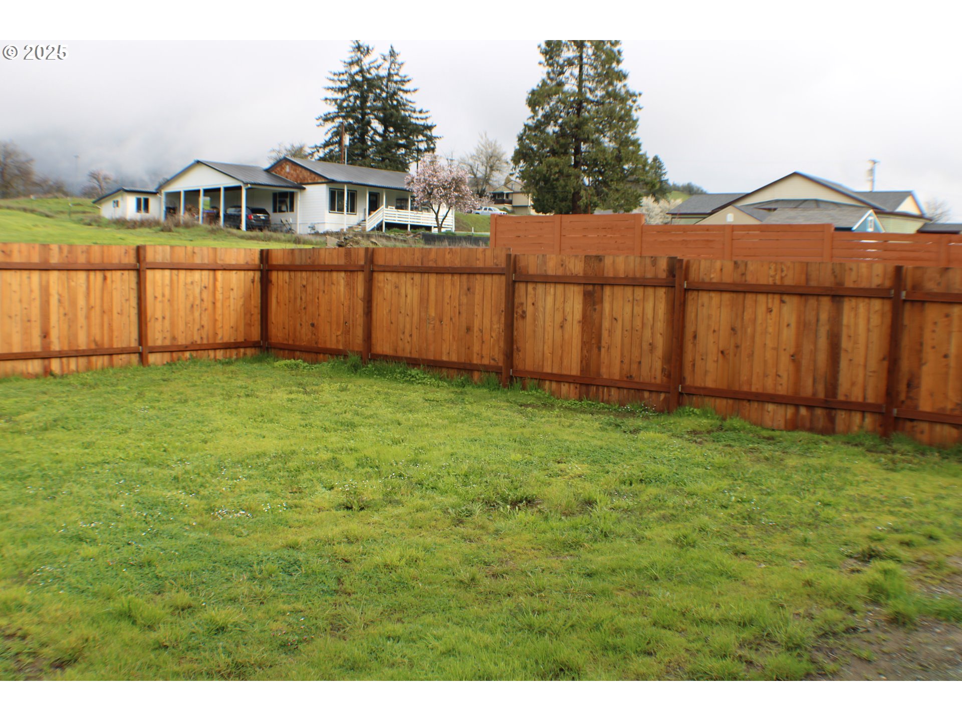 616 4th Avenue Riddle, OR 97469 - Photo 33 of 36 a view of a yard with wooden fence