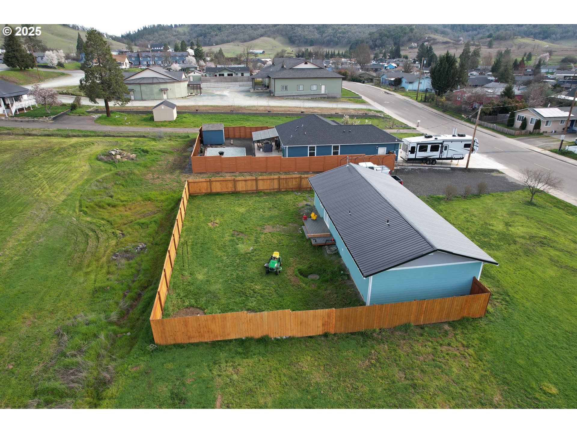616 4th Avenue Riddle, OR 97469 - Photo 35 of 36 an aerial view of a house with garden space and lake view