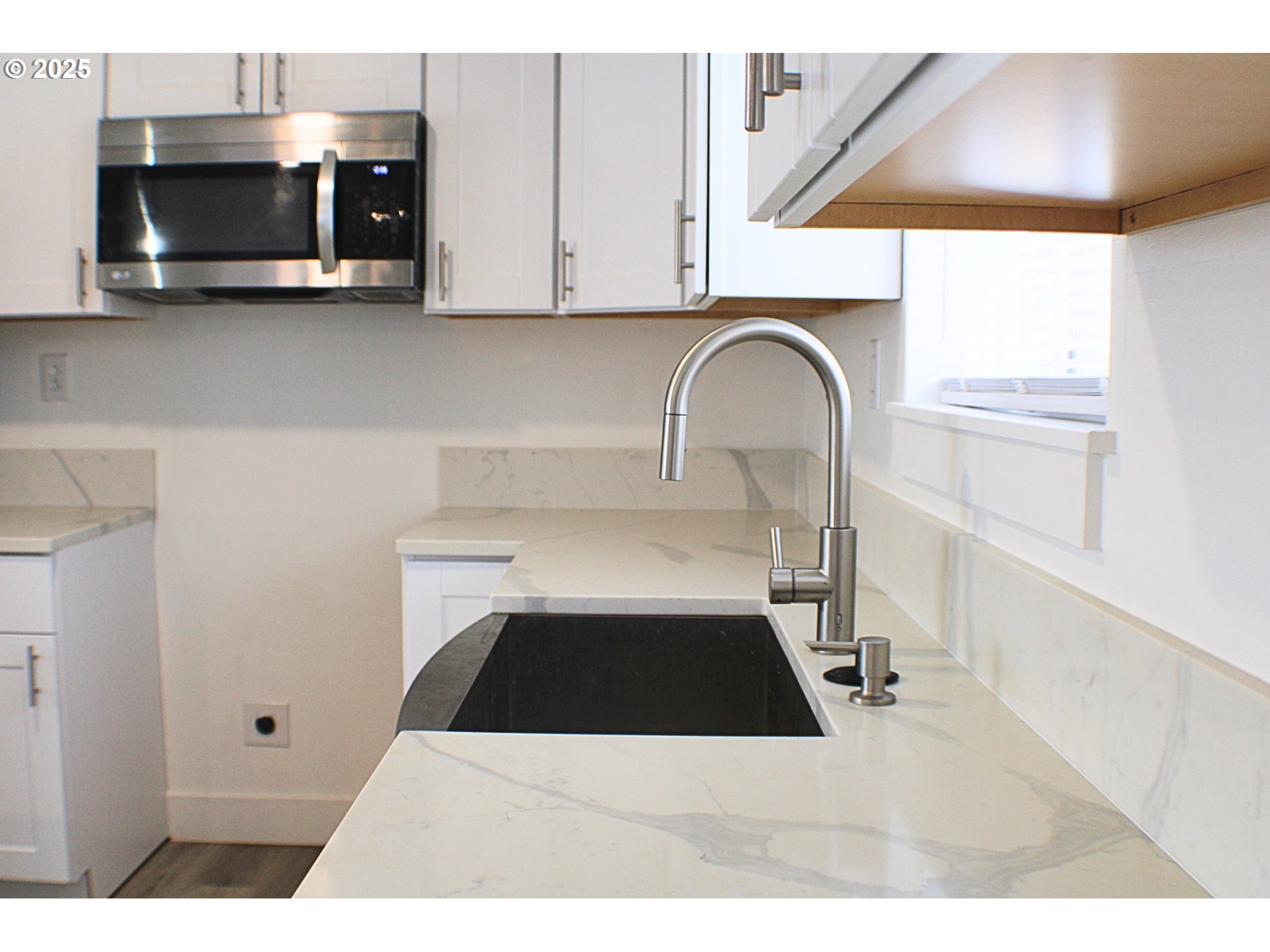 616 4th Avenue Riddle, OR 97469 - Photo 8 of 36 a kitchen with a stove and white cabinets