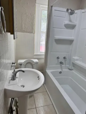 a bathroom with a sink and a bathtub
