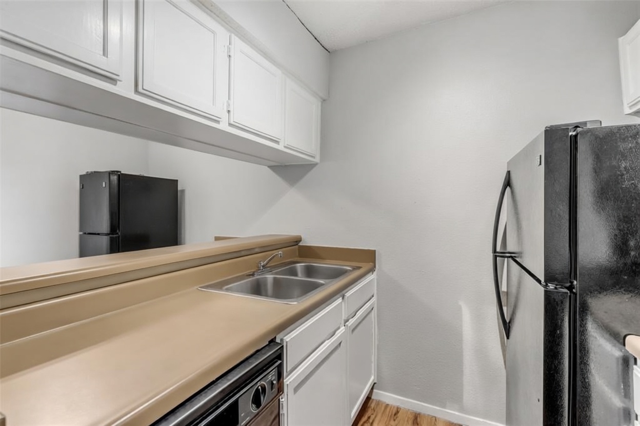 3115 Helms Street, Unit 210 Austin, TX 78705 - Photo 8 of 17 a utility room with dryer and washer
