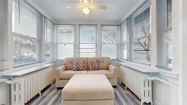 a bedroom with furniture and windows