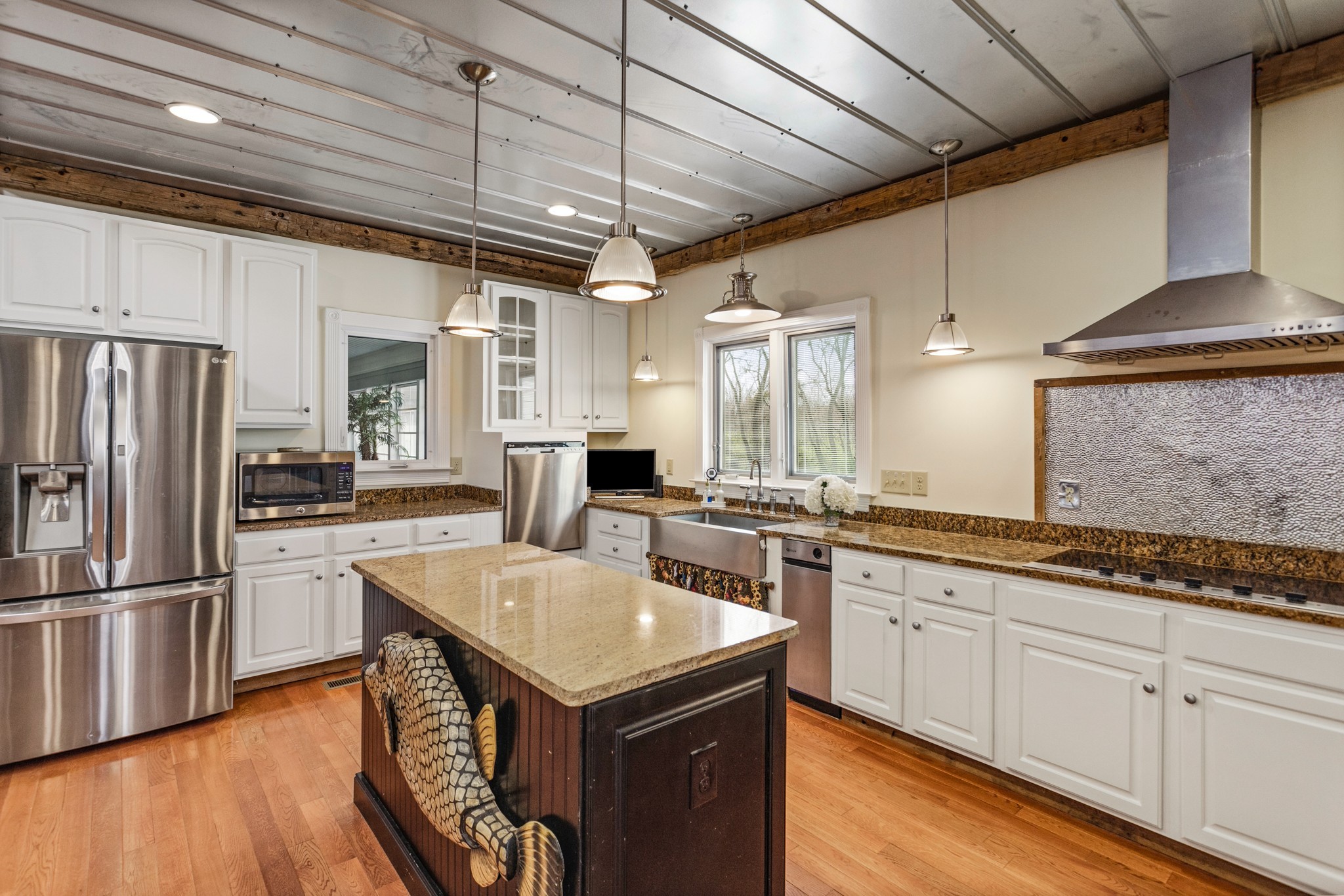 2833 Thompson's Station Road East Thompson's Station, TN 37179 - Photo 12 of 38 a kitchen with granite countertop a sink appliances cabinets and counter space