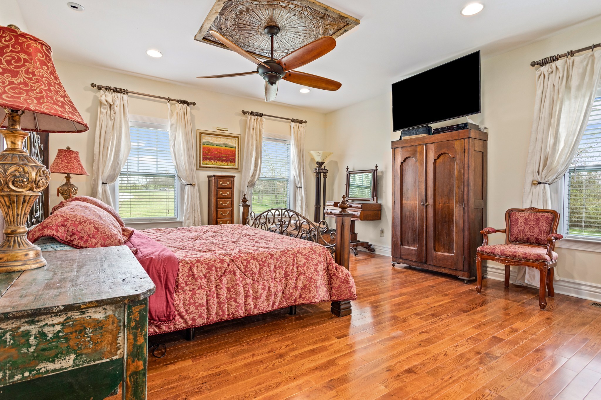 2833 Thompson's Station Road East Thompson's Station, TN 37179 - Photo 16 of 38 a bedroom with a bed and wooden floor