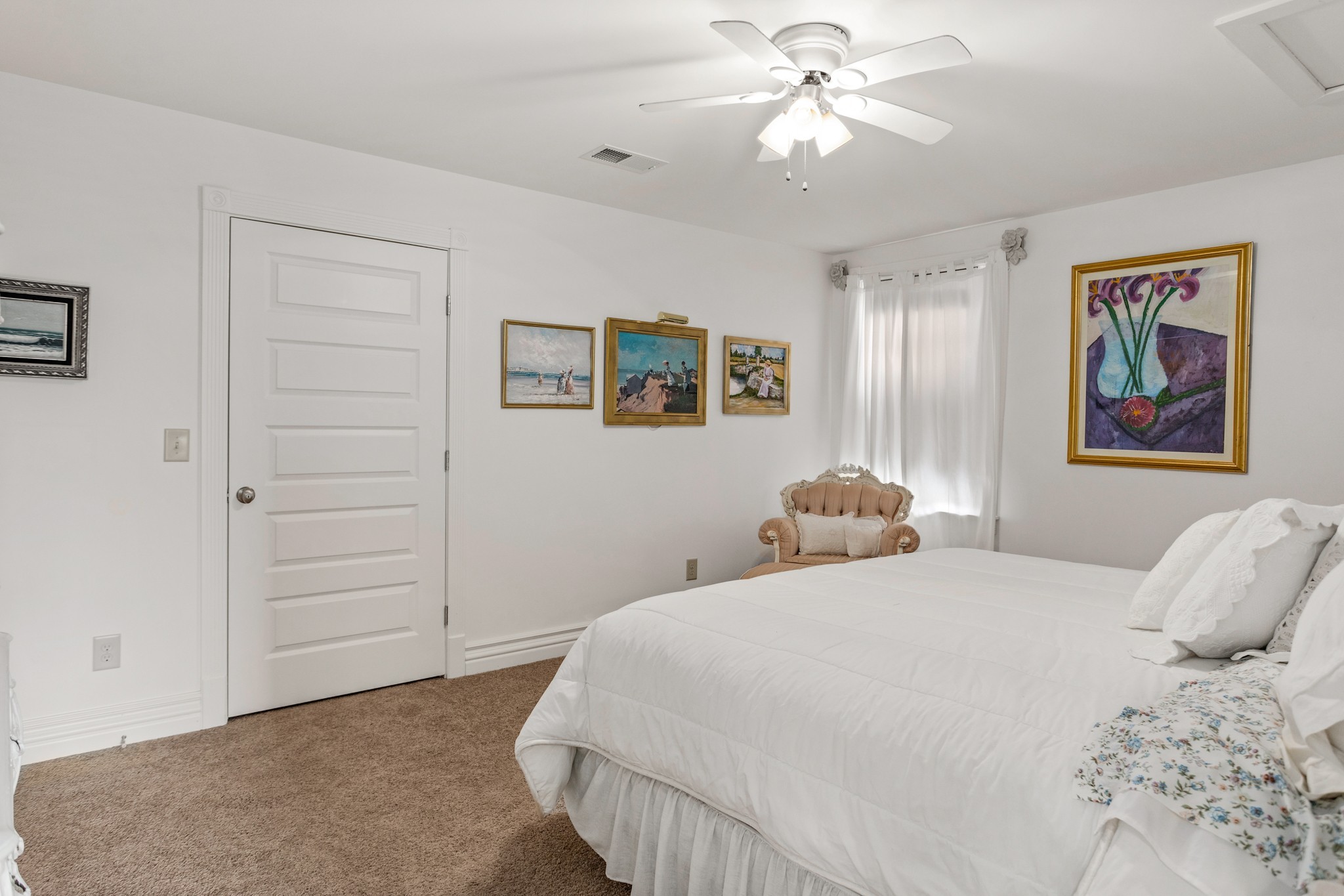 2833 Thompson's Station Road East Thompson's Station, TN 37179 - Photo 18 of 38 a bedroom with a large bed and a chandelier
