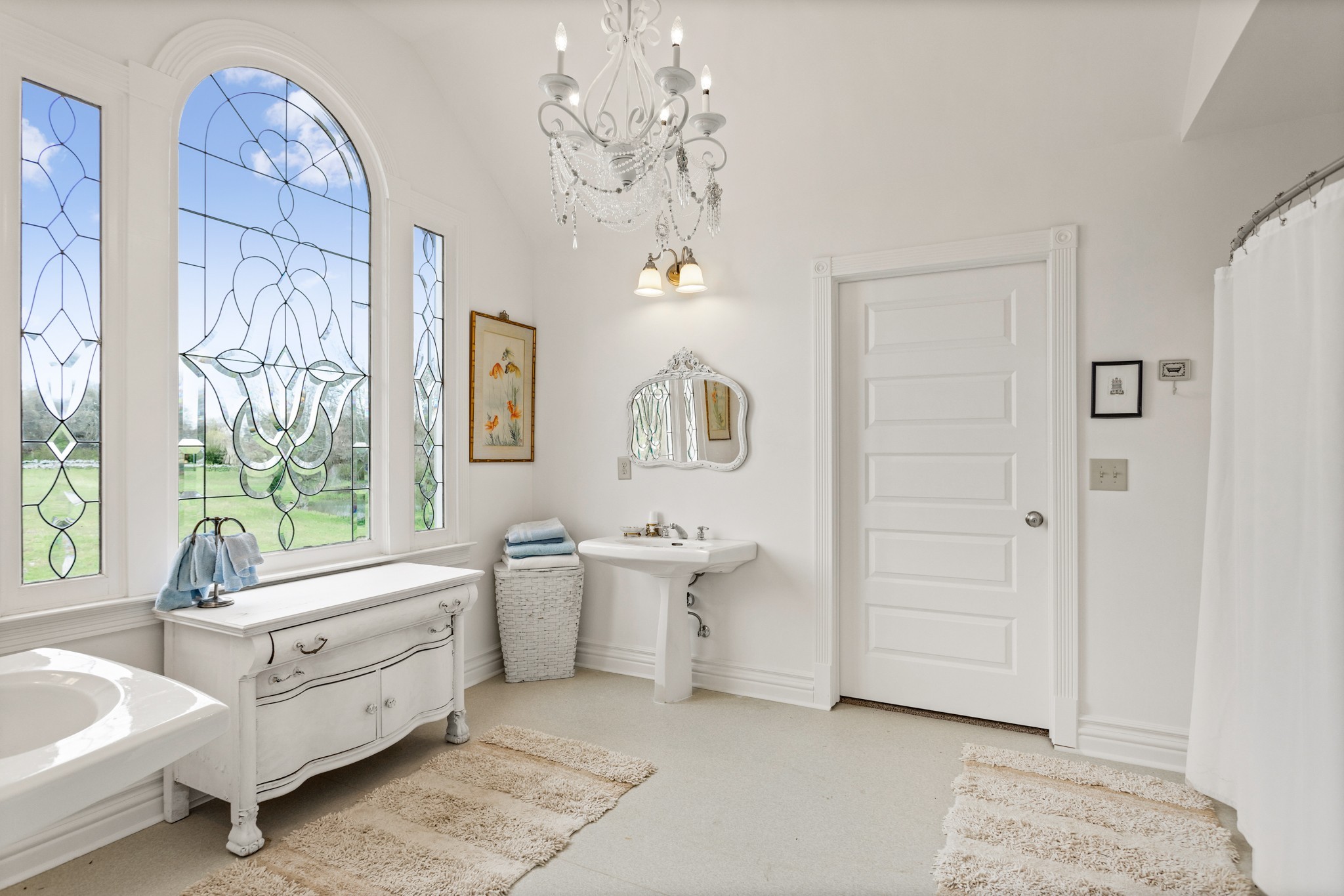 2833 Thompson's Station Road East Thompson's Station, TN 37179 - Photo 20 of 38 a bathroom with a double vanity sink a mirror and a bathtub