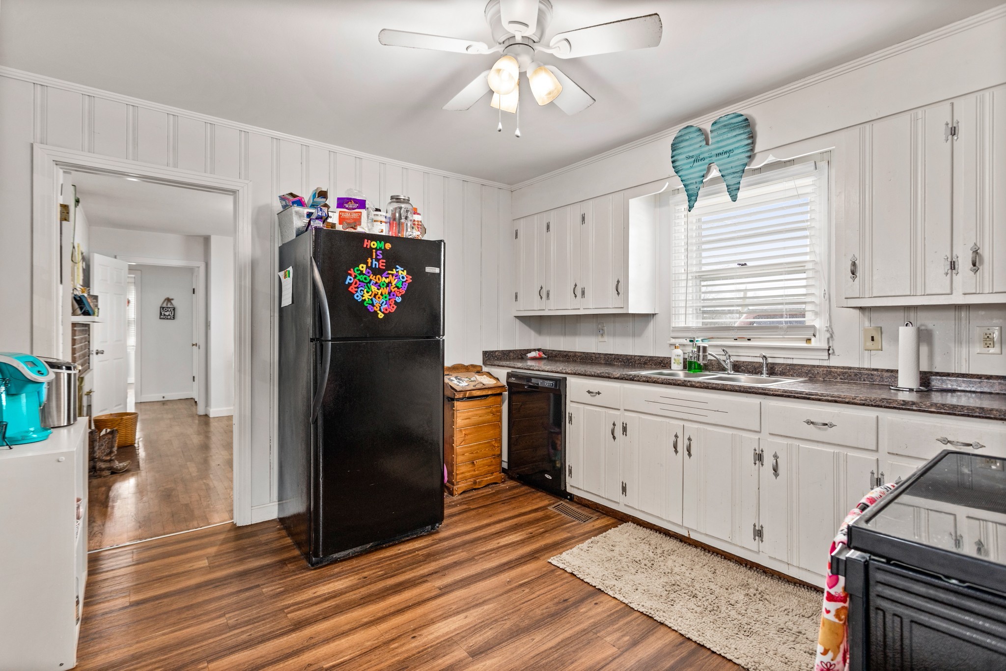 2833 Thompson's Station Road East Thompson's Station, TN 37179 - Photo 32 of 38 a kitchen with granite countertop a refrigerator and a sink