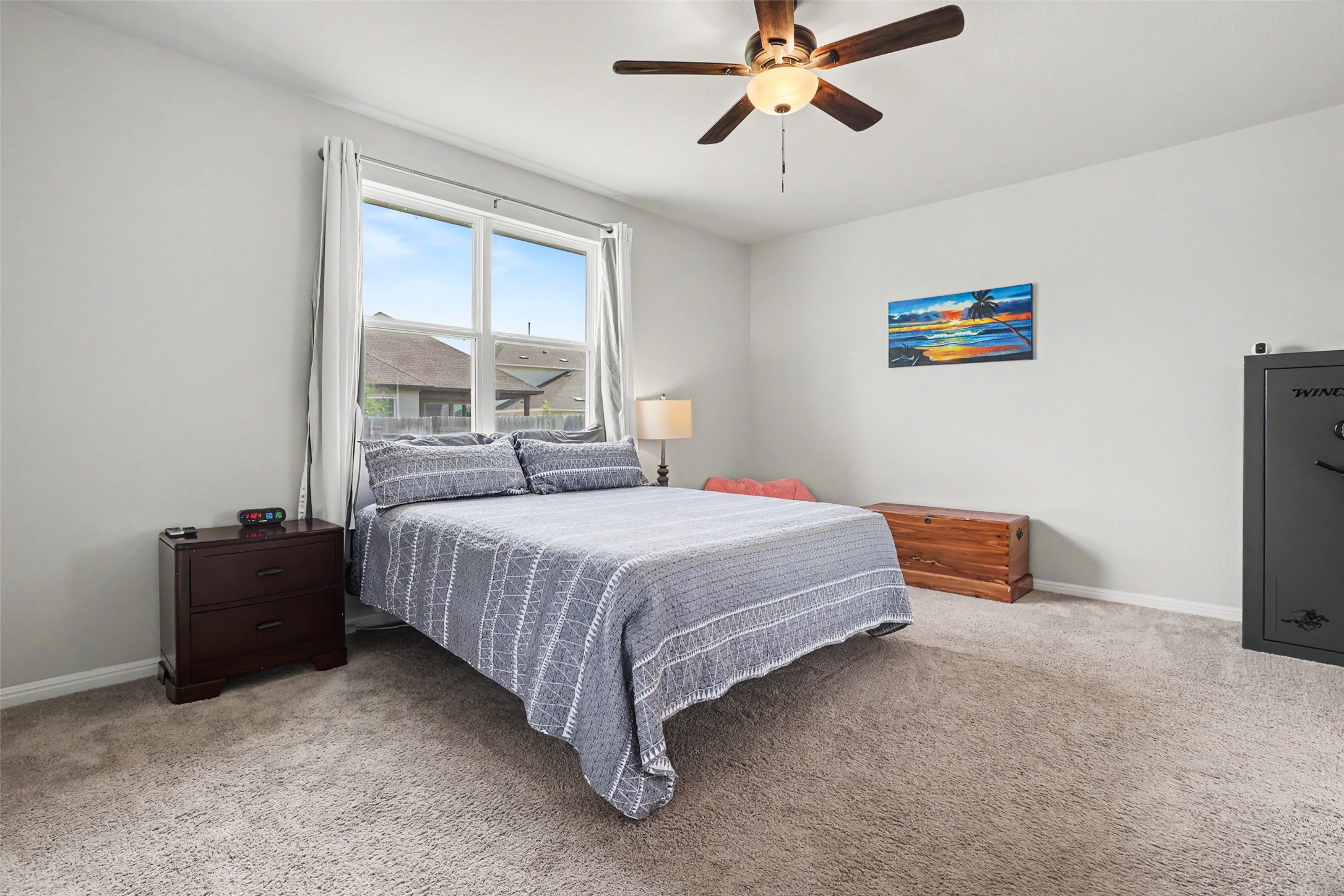 112 Rocking R Court Georgetown, TX 78633 - Photo 14 of 40 A naturally illuminated bedroom offers comfort with a large window and convenient ceiling fan.