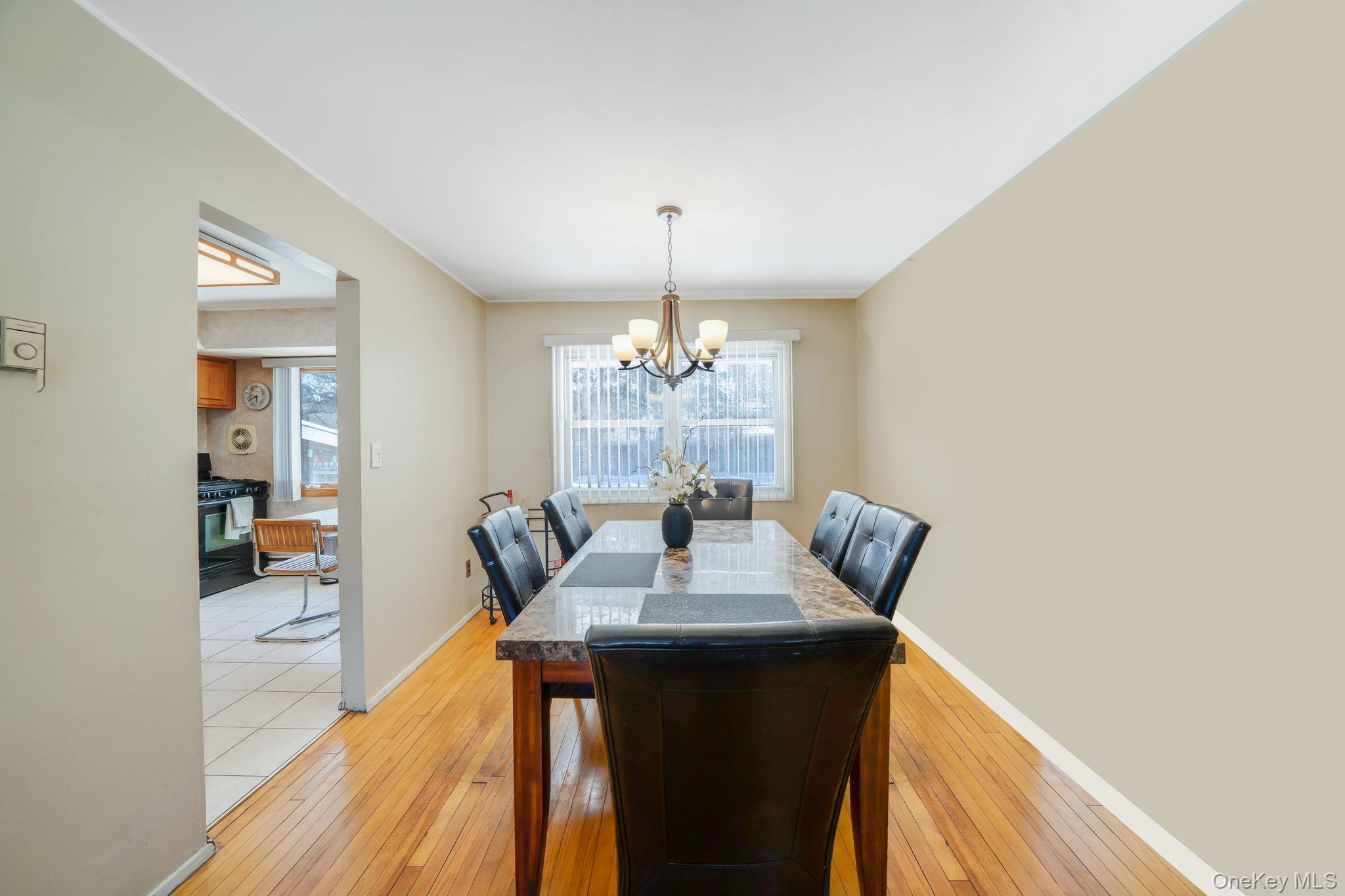 24 Kings Park Road Commack, NY 11725 - Photo 15 of 32 a dining room with furniture and window