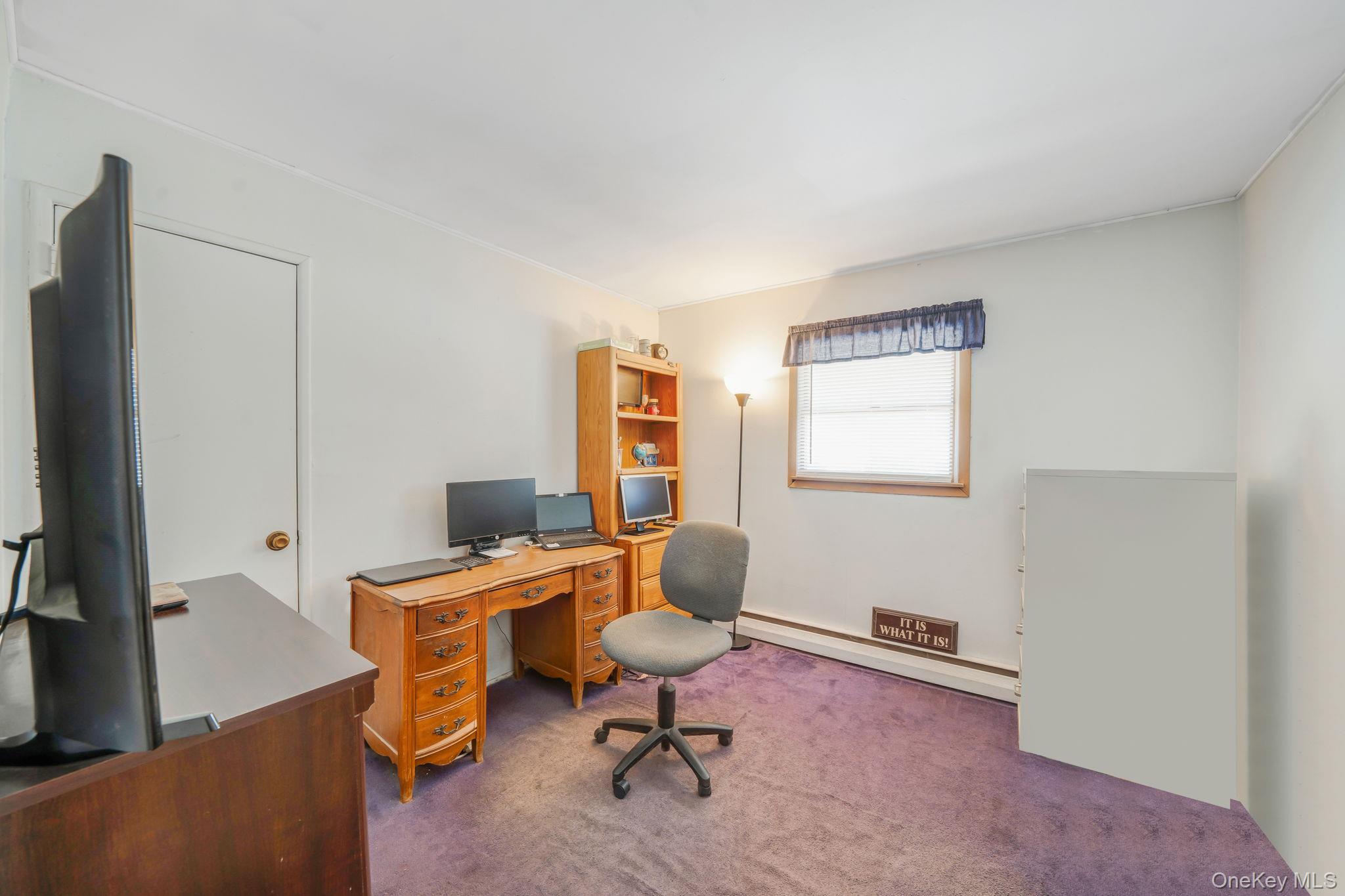 24 Kings Park Road Commack, NY 11725 - Photo 25 of 32 a view of a workspace with furniture and a window