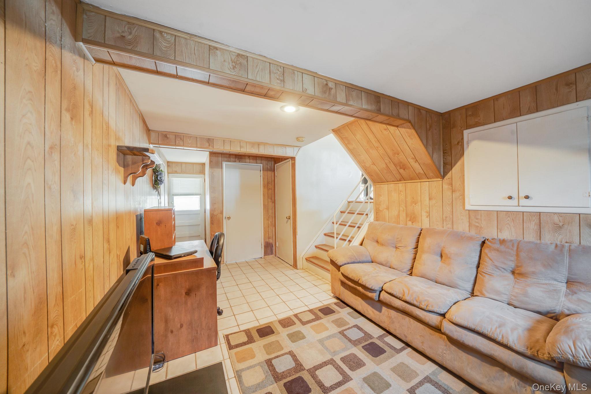 24 Kings Park Road Commack, NY 11725 - Photo 27 of 32 a living room with furniture and a large window