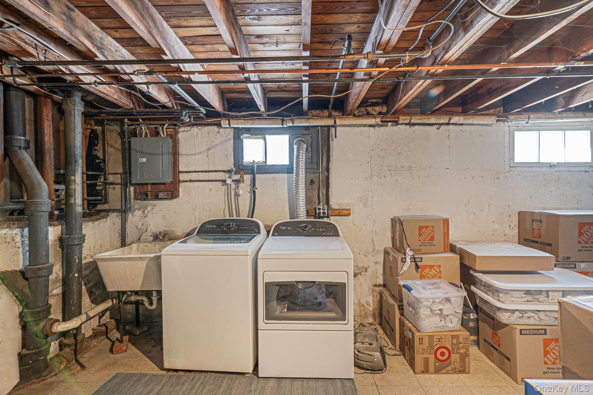 24 Kings Park Road Commack, NY 11725 - Photo 30 of 32 a utility room with dryer washer and stair
