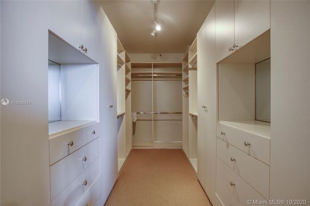 a bathroom with a double vanity sink and mirror