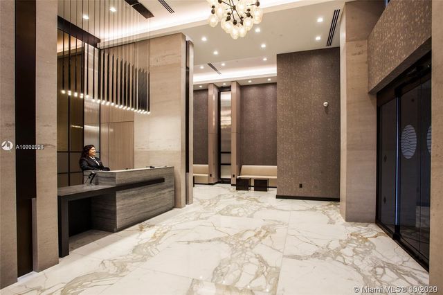 a bathroom with a sink a mirror and shower