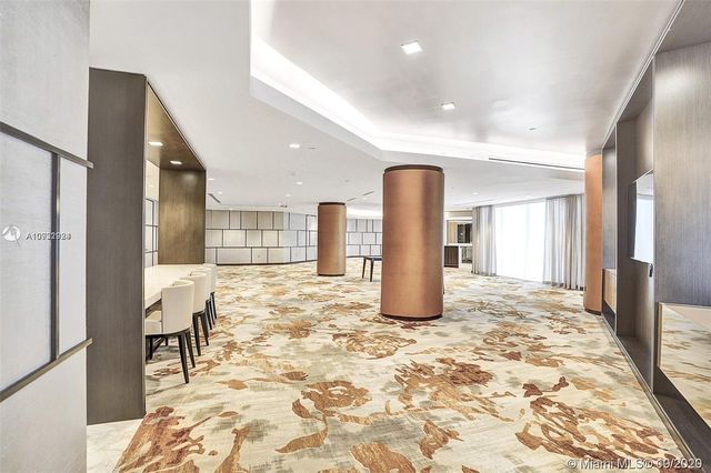 a view of a livingroom with a dinning table and chair