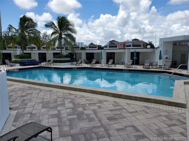 a view of a swimming pool with lounge chair