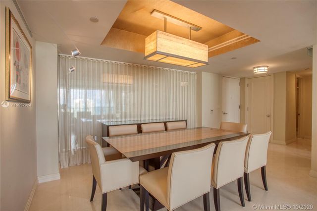 a view of a dining table and chairs in a room