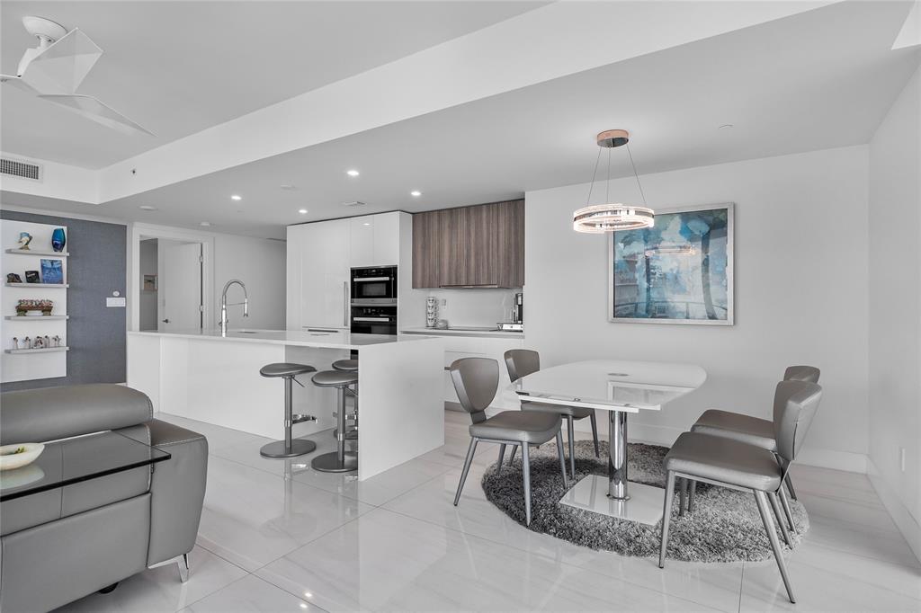 730 North Ocean Boulevard, Unit 1501 Pompano Beach, FL 33062 - Photo 14 of 56 a living room with furniture and kitchen view