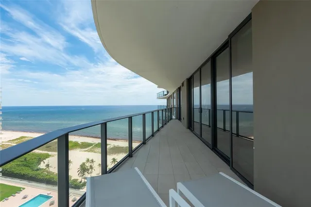 a view of swimming pool with a table and chairs