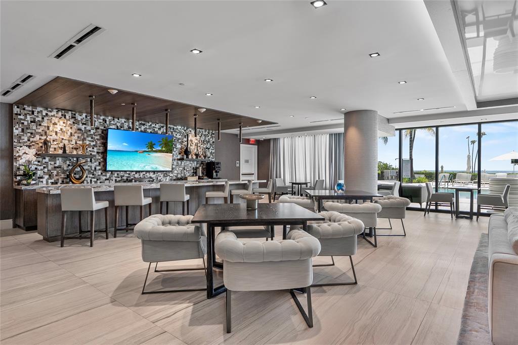 730 North Ocean Boulevard, Unit 1501 Pompano Beach, FL 33062 - Photo 31 of 56 a living room with furniture and a large window