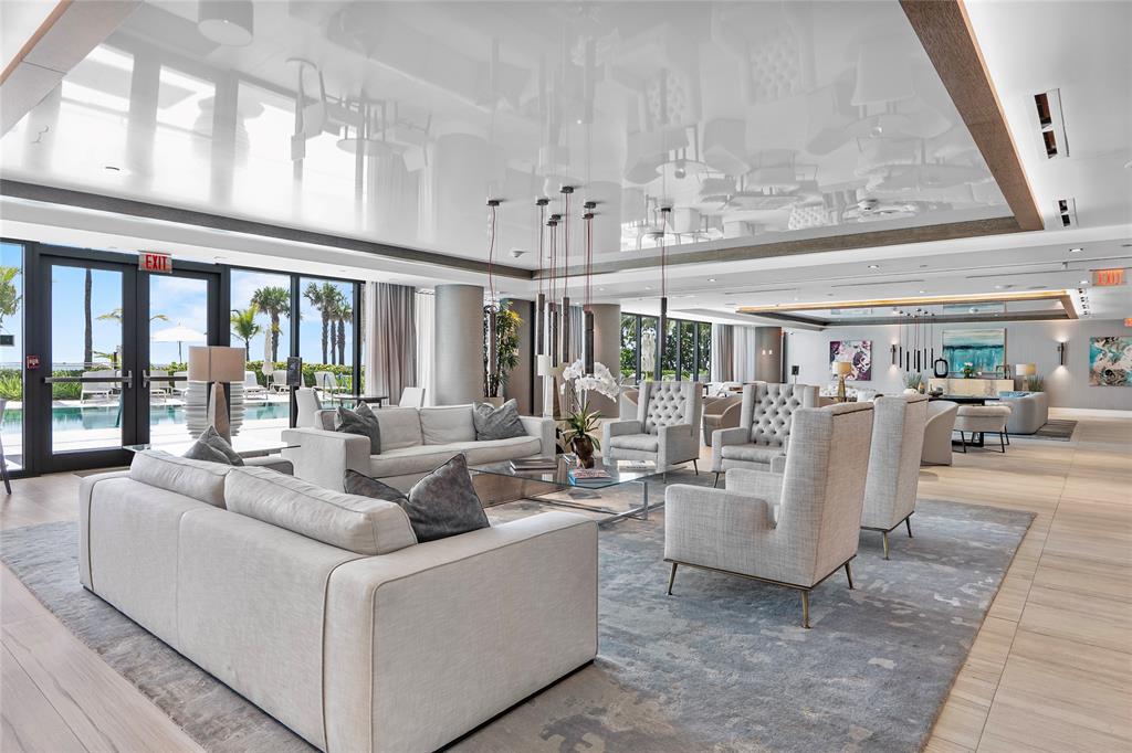 730 North Ocean Boulevard, Unit 1501 Pompano Beach, FL 33062 - Photo 33 of 56 a living room with furniture and chandelier