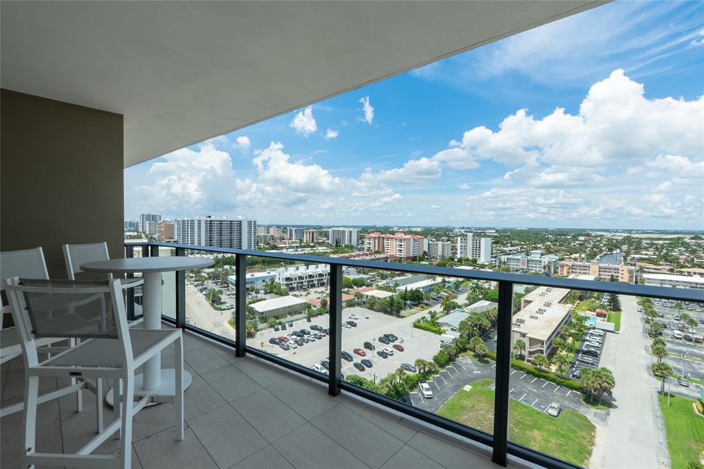 730 North Ocean Boulevard, Unit 1501 Pompano Beach, FL 33062 - Photo 42 of 56 a view of a city from a balcony with outdoor seating