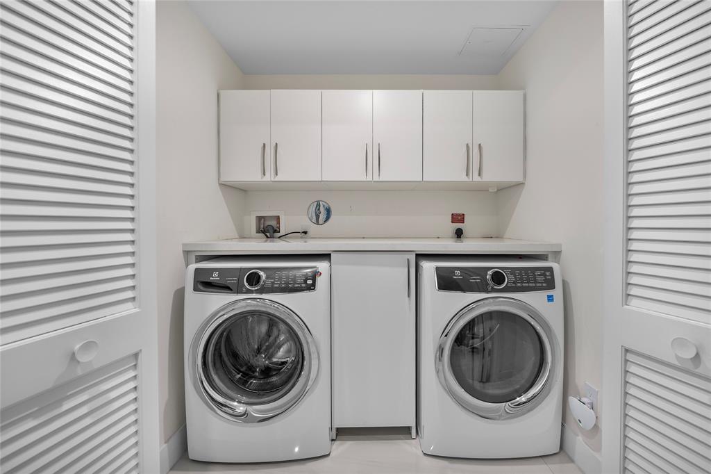 730 North Ocean Boulevard, Unit 1501 Pompano Beach, FL 33062 - Photo 46 of 56 a utility room with dryer and washer
