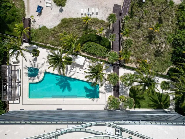a view of swimming pool with a yard in back