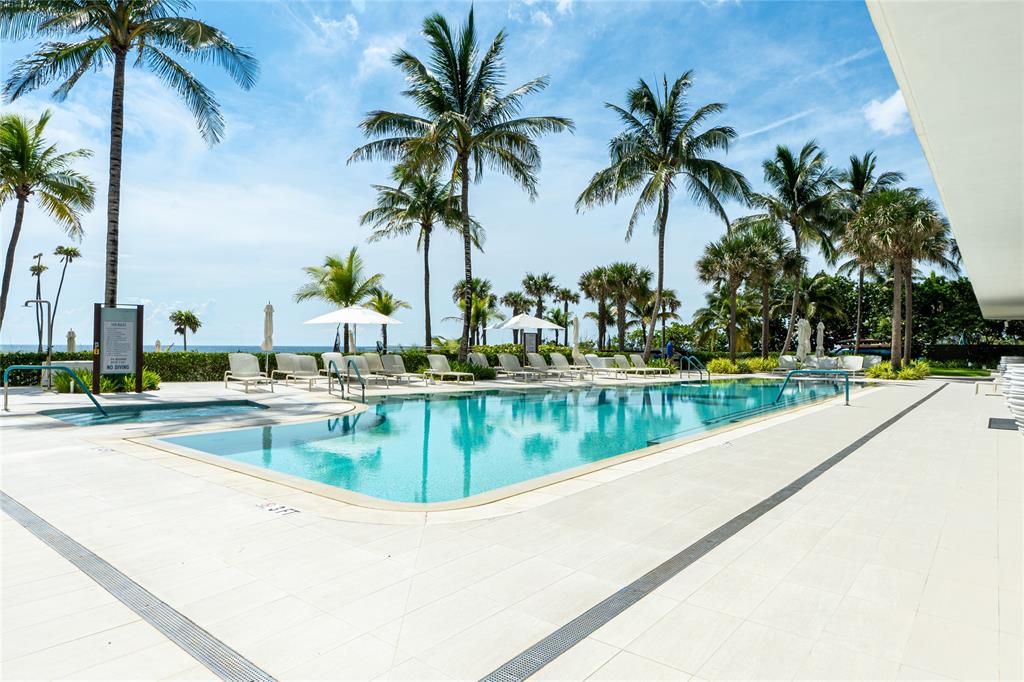 730 North Ocean Boulevard, Unit 1501 Pompano Beach, FL 33062 - Photo 5 of 56 a view of swimming pool with a table and chairs