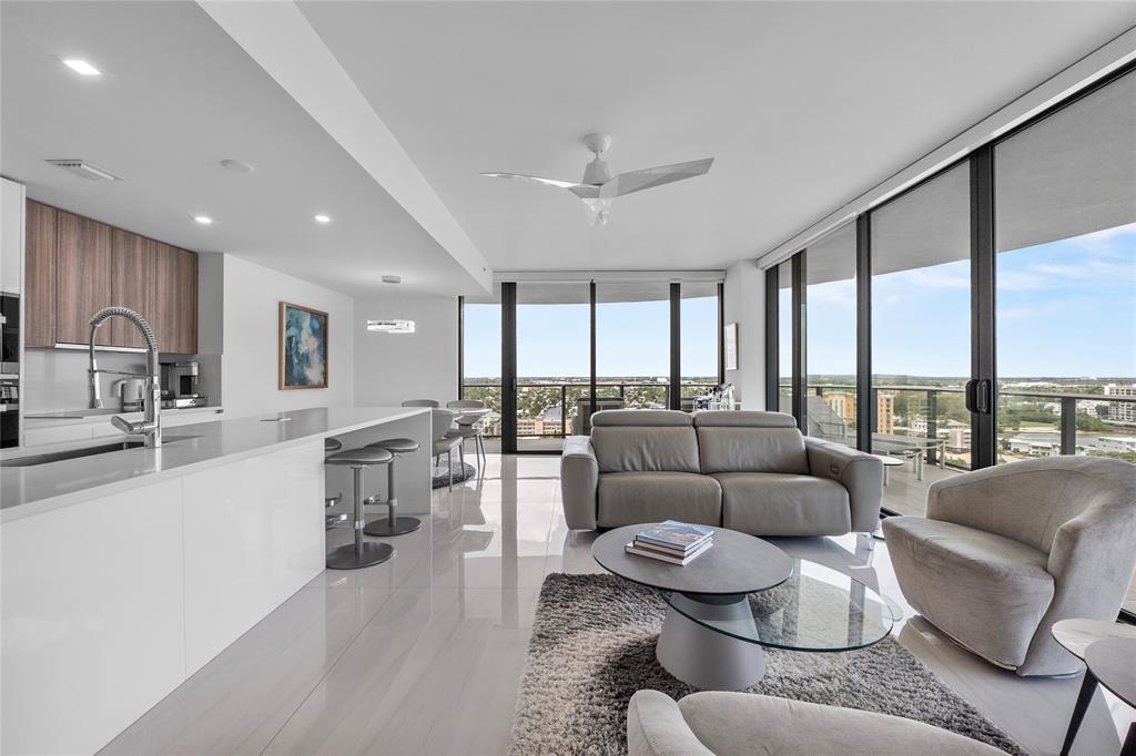 730 North Ocean Boulevard, Unit 1501 Pompano Beach, FL 33062 - Photo 6 of 56 a living room with furniture and a large window