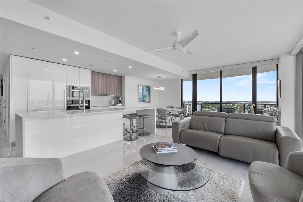 730 North Ocean Boulevard, Unit 1501 Pompano Beach, FL 33062 - Photo 7 of 56 a living room with furniture and a large window