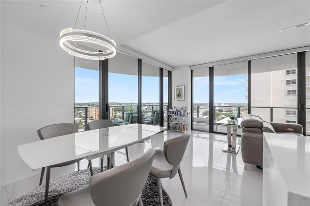 a large kitchen with kitchen island a sink stainless steel appliances and cabinets