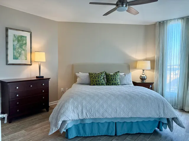 a bedroom with a bed and window