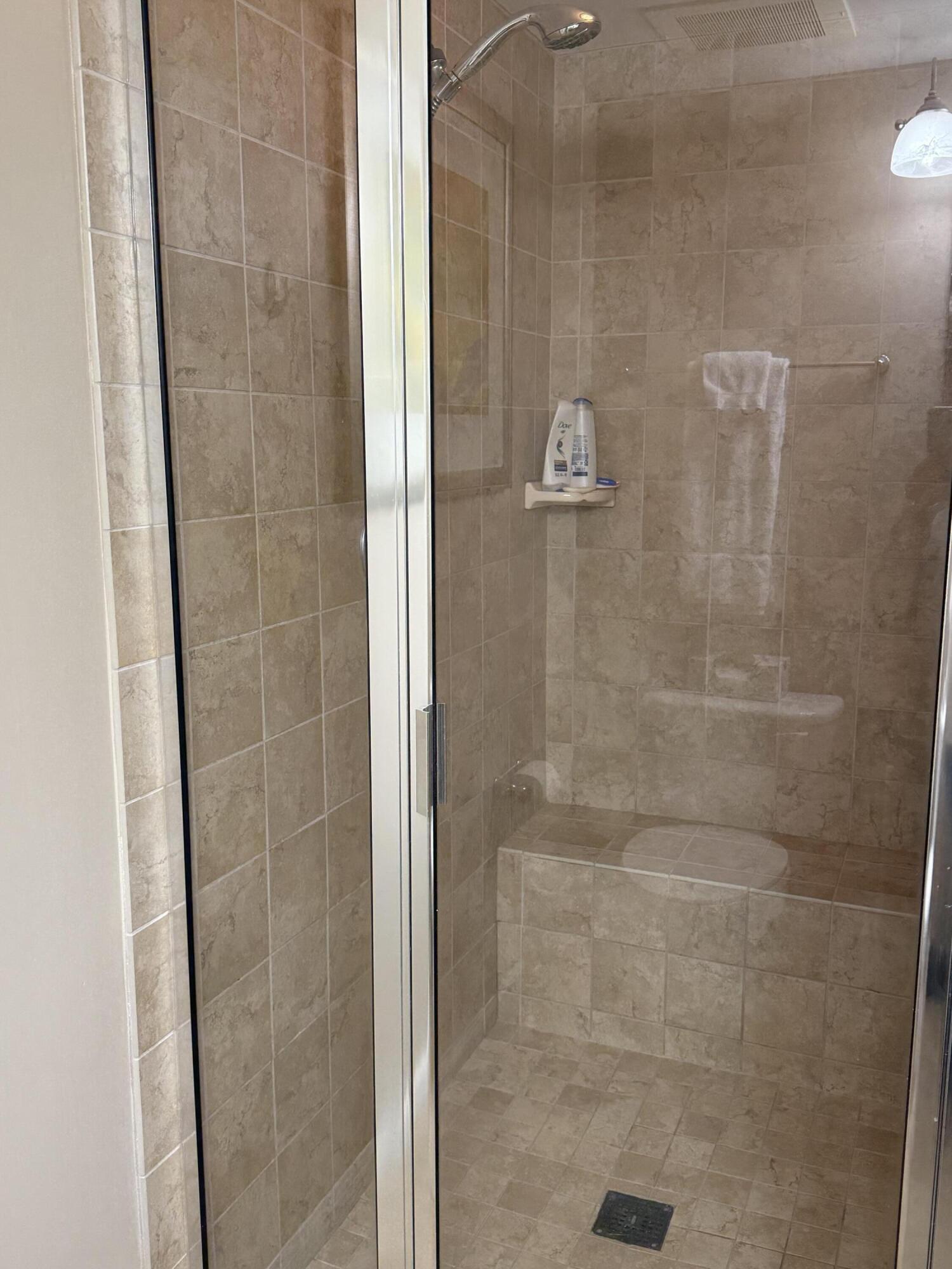 4203 Indian Bayou Trail, Unit 1816 Destin, FL 32541 - Photo 14 of 17 a bathroom with a shower